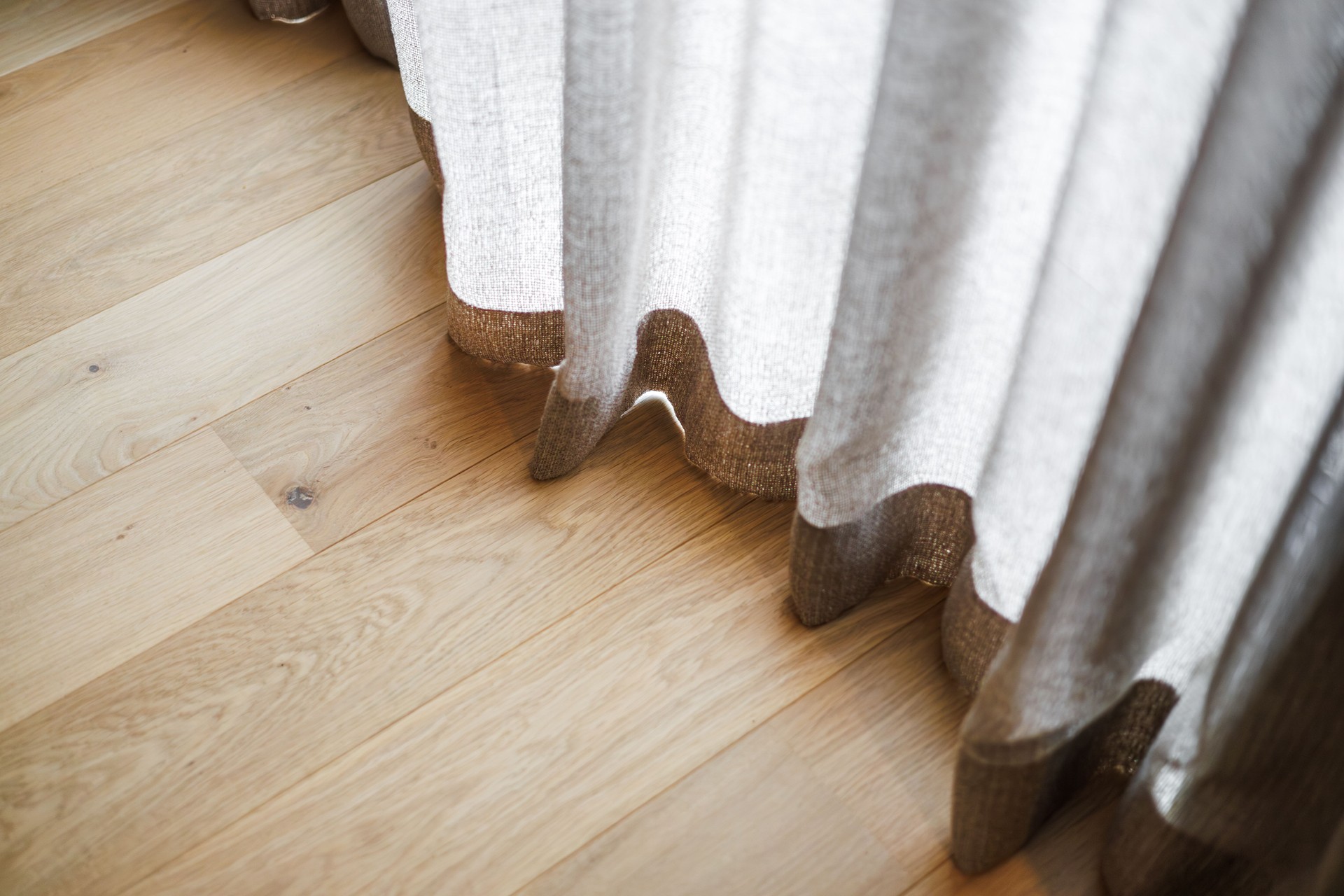 Sunlight Touching Curtain and Wooden Floor